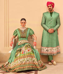 Exclusively for couple combo Green designer outfit in pure pv silk and foil print with detailed hand mirror work