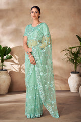 Beautiful Exclusive pastel shaded net saree with detailed work of sequins, thread and zarkan