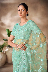 Beautiful Exclusive pastel shaded net saree with detailed work of sequins, thread and zarkan
