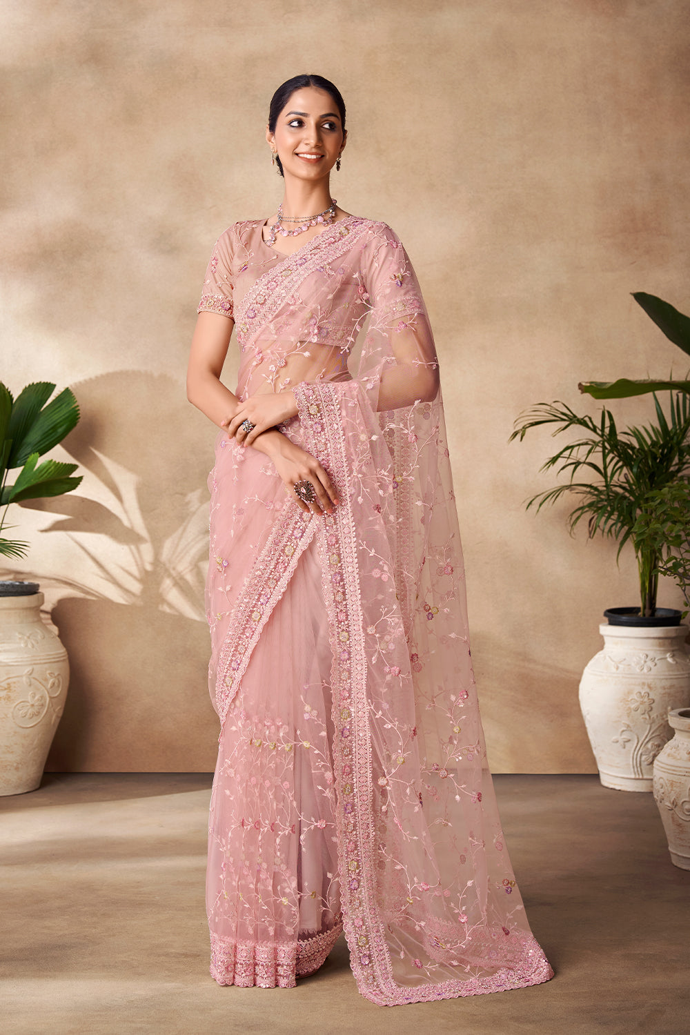 Beautiful Exclusive pastel shaded net saree with detailed work of sequins, thread and zarkan