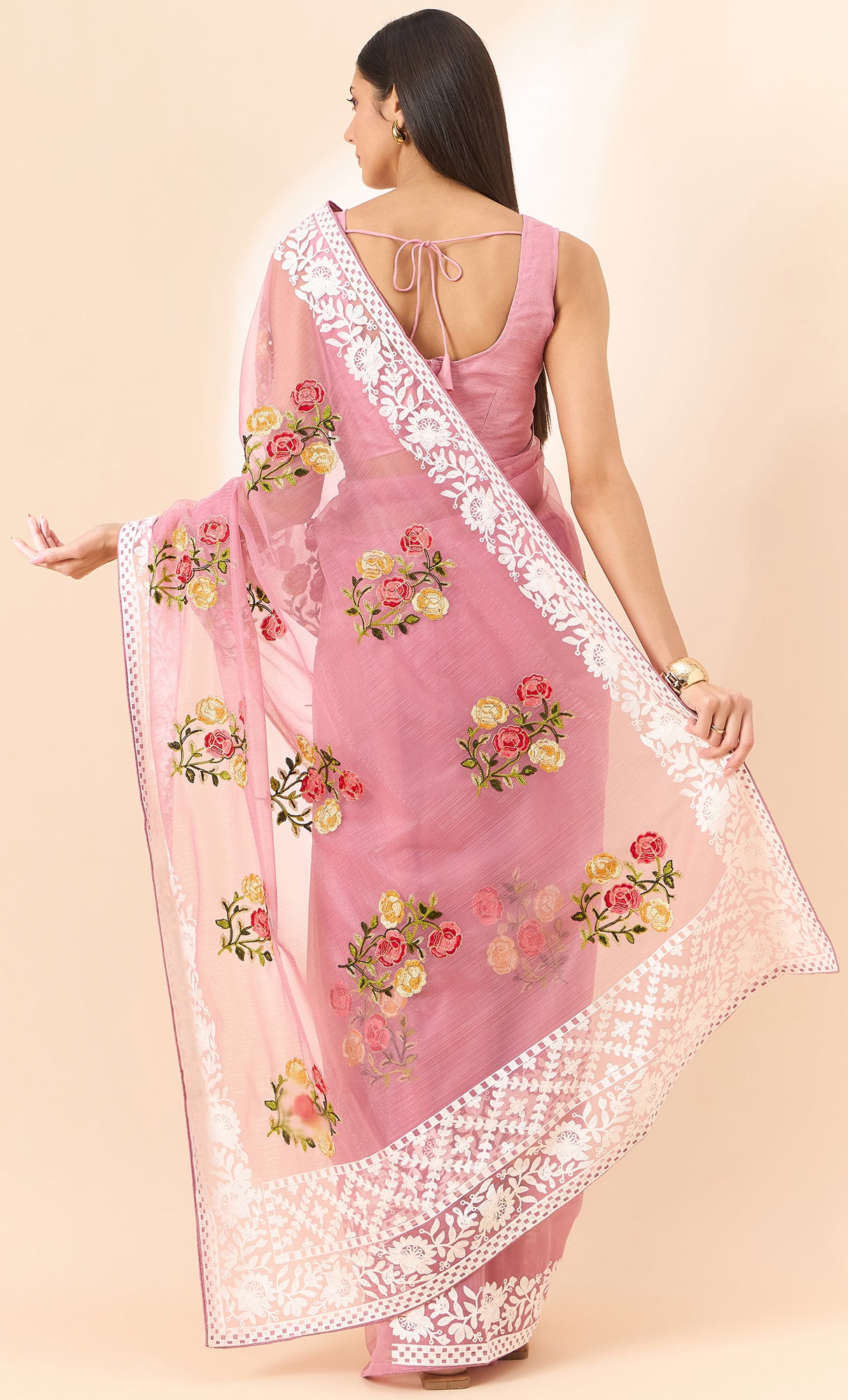 Latest light pink shaded organza saree with detailed embroidery and floral inspired design saree for all occassion