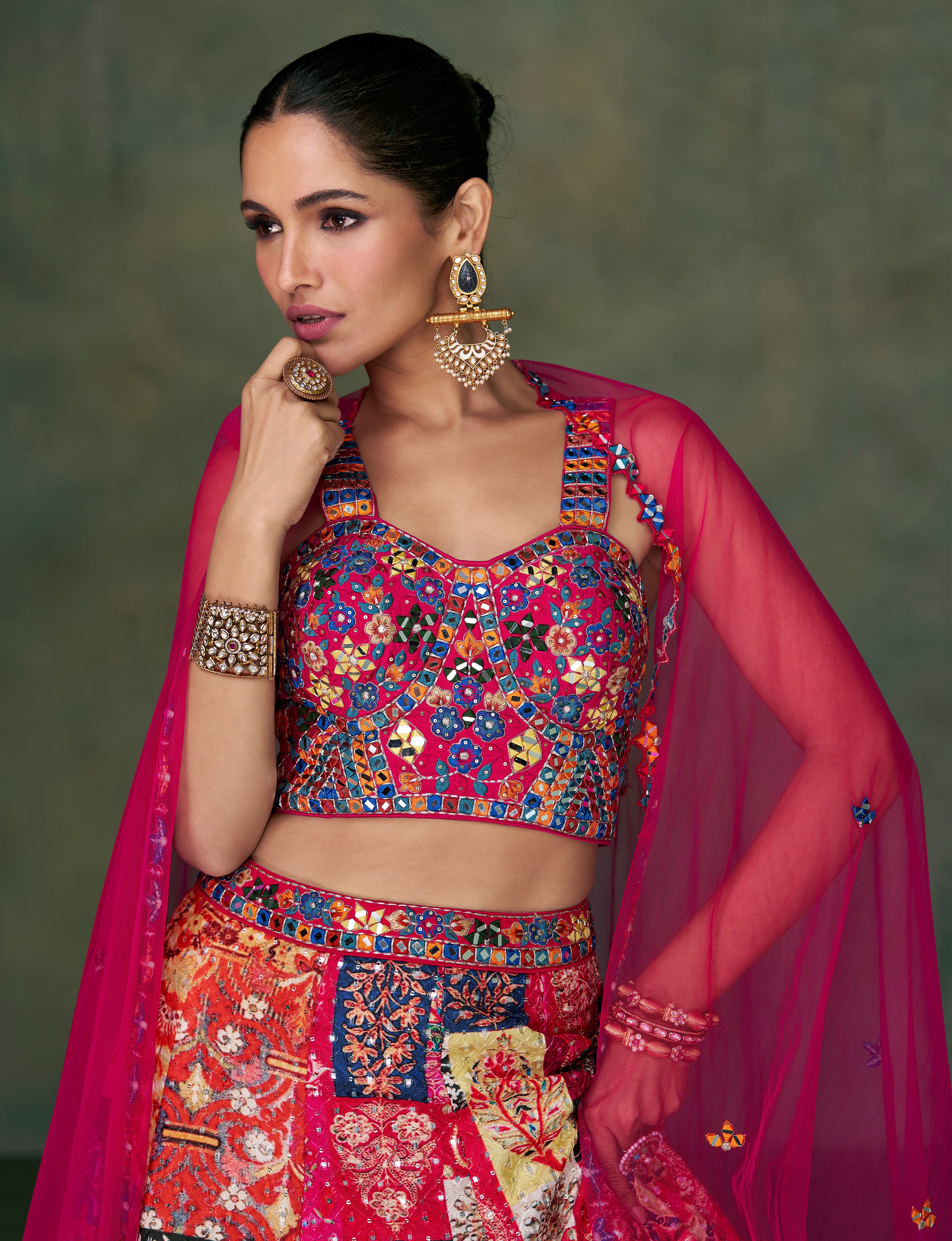 Pink Contrasting silk designer lehenga with detailed embroidery work dupata in net