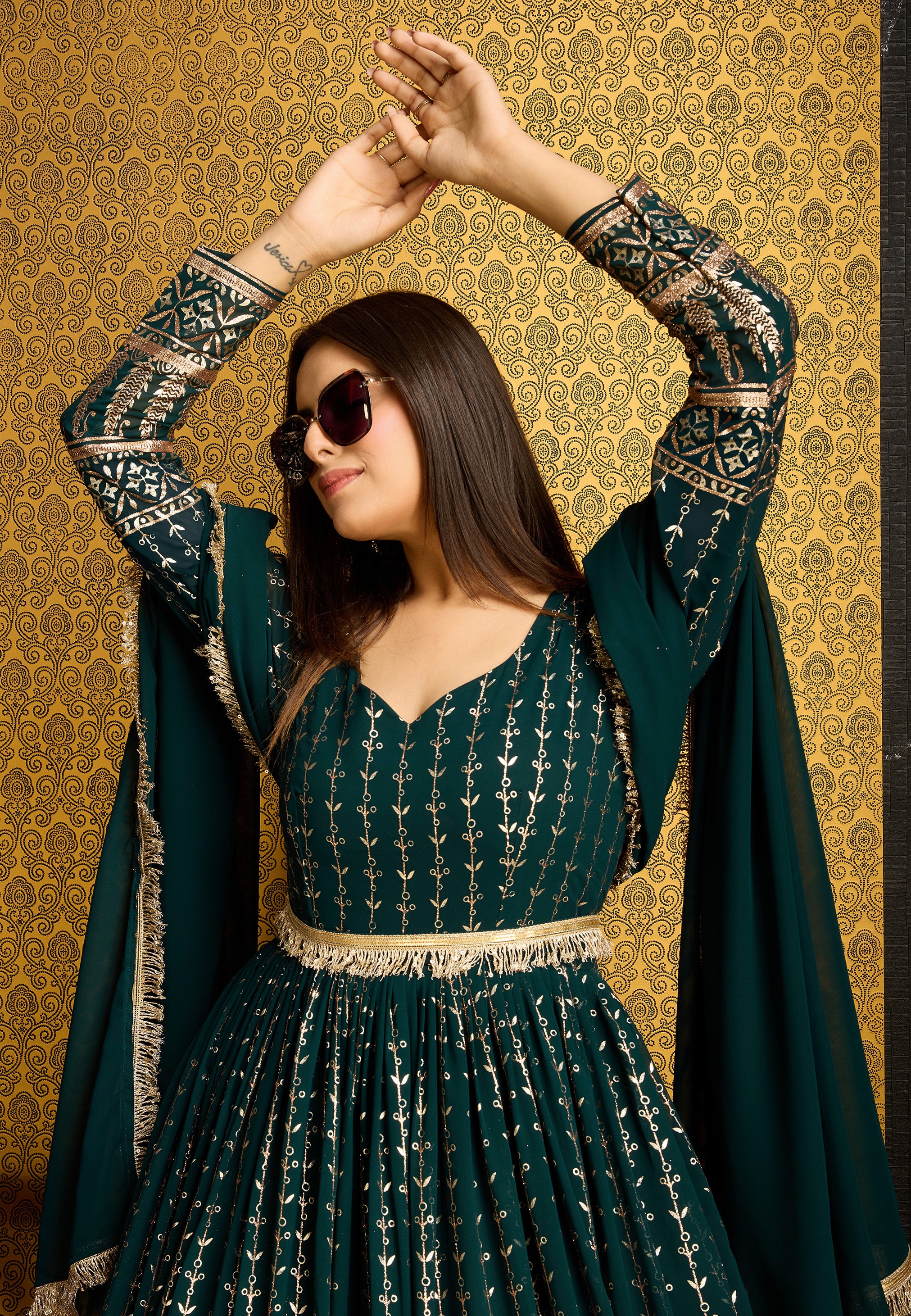 Exclusive Designer Green Gown on georgette with detailed metallic foil work and handwork on neck