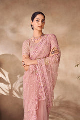 Beautiful Exclusive pastel shaded net saree with detailed work of sequins, thread and zarkan