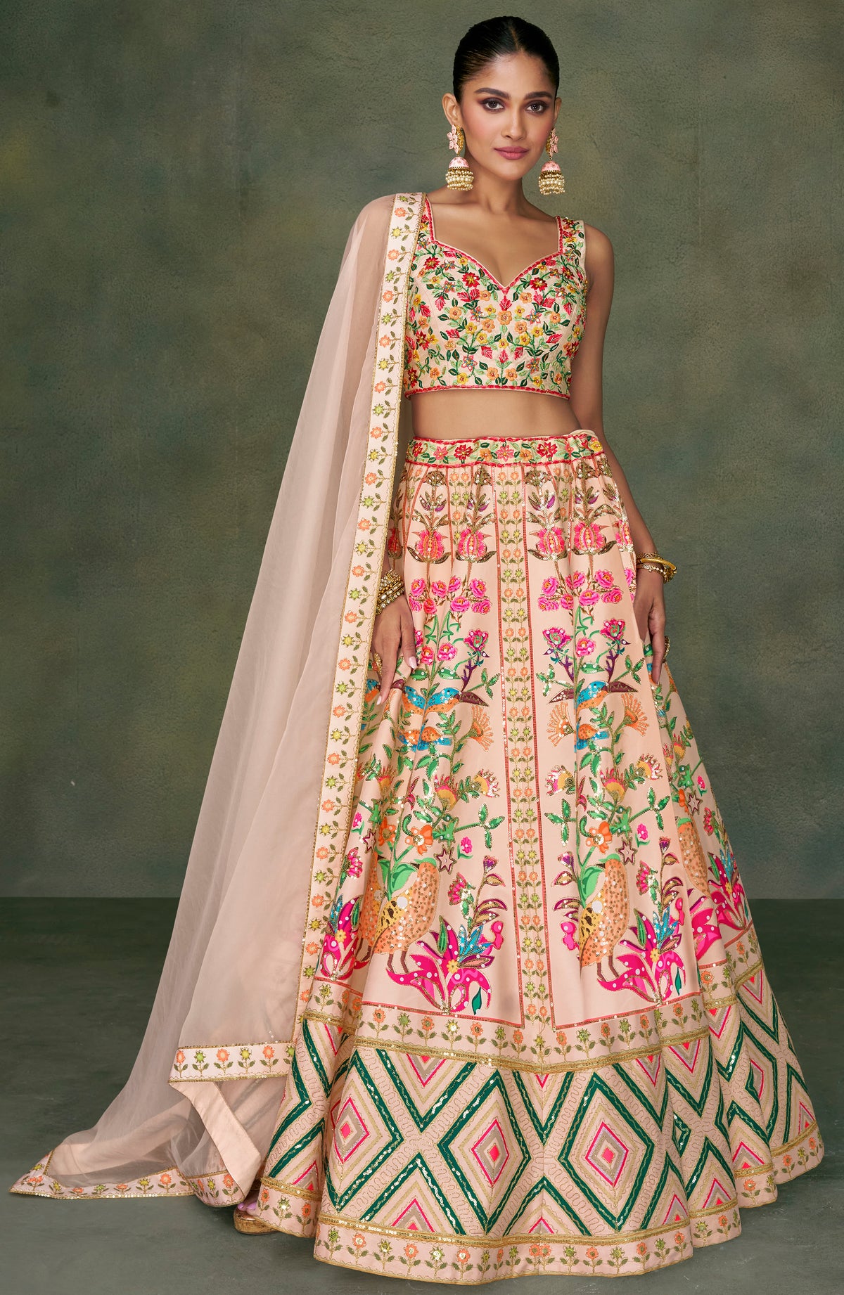 Contrasting silk designer lehenga with detailed embroidery work dupata in net