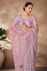 Beautiful Exclusive pastel shaded net saree with detailed work of sequins, thread and zarkan