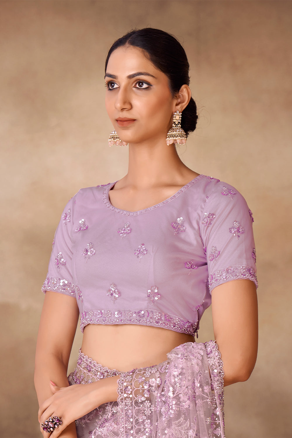 Beautiful Exclusive pastel shaded net saree with detailed work of sequins, thread and zarkan