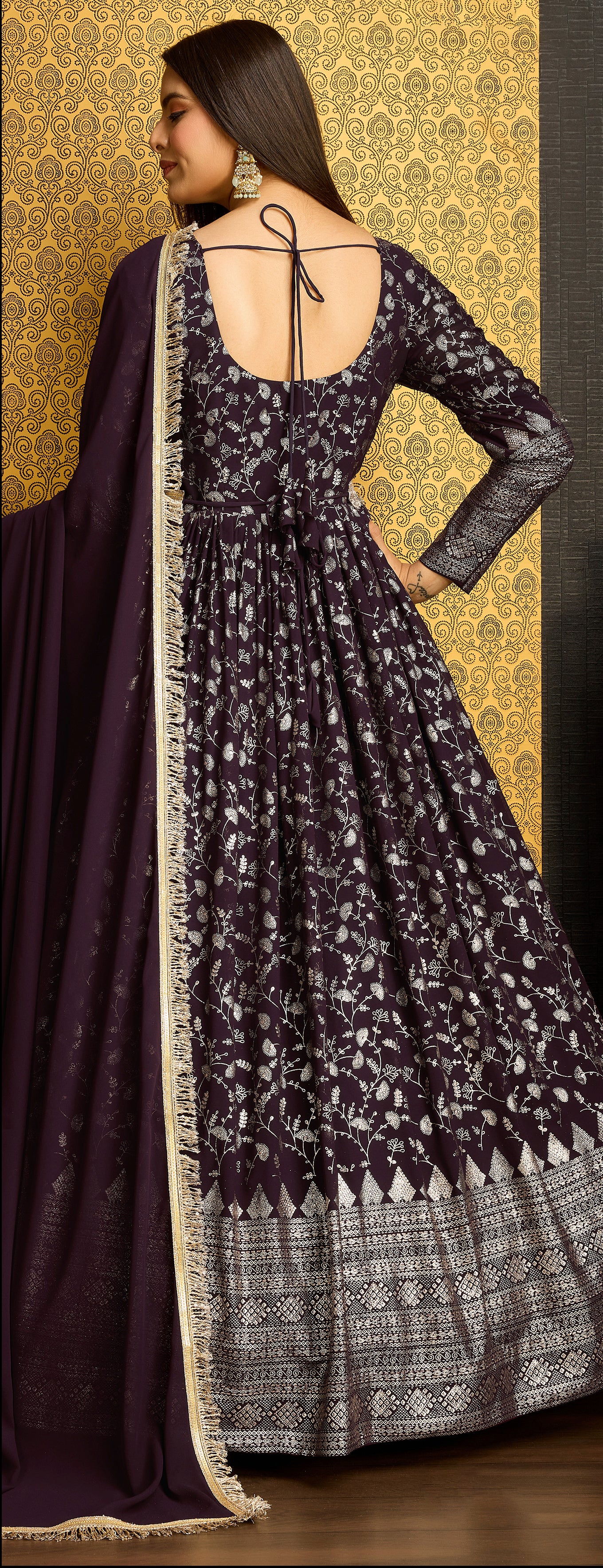 Exclusive Designer Wine Gown on georgette with detailed metallic foil work and handwork on neck