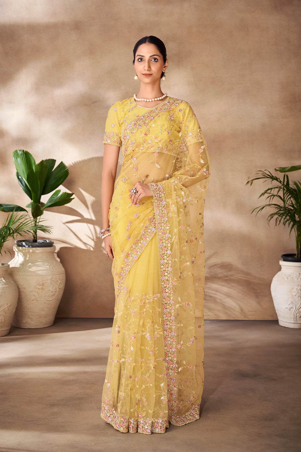 Beautiful Exclusive pastel shaded net saree with detailed work of sequins, thread and zarkan