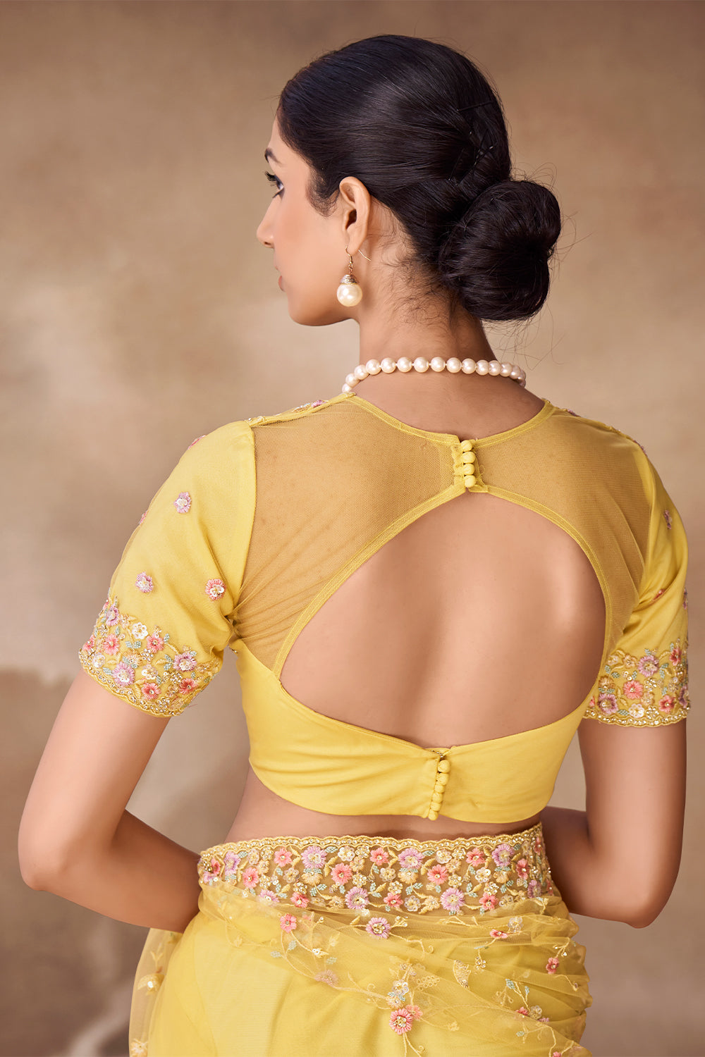 Beautiful Exclusive pastel shaded net saree with detailed work of sequins, thread and zarkan