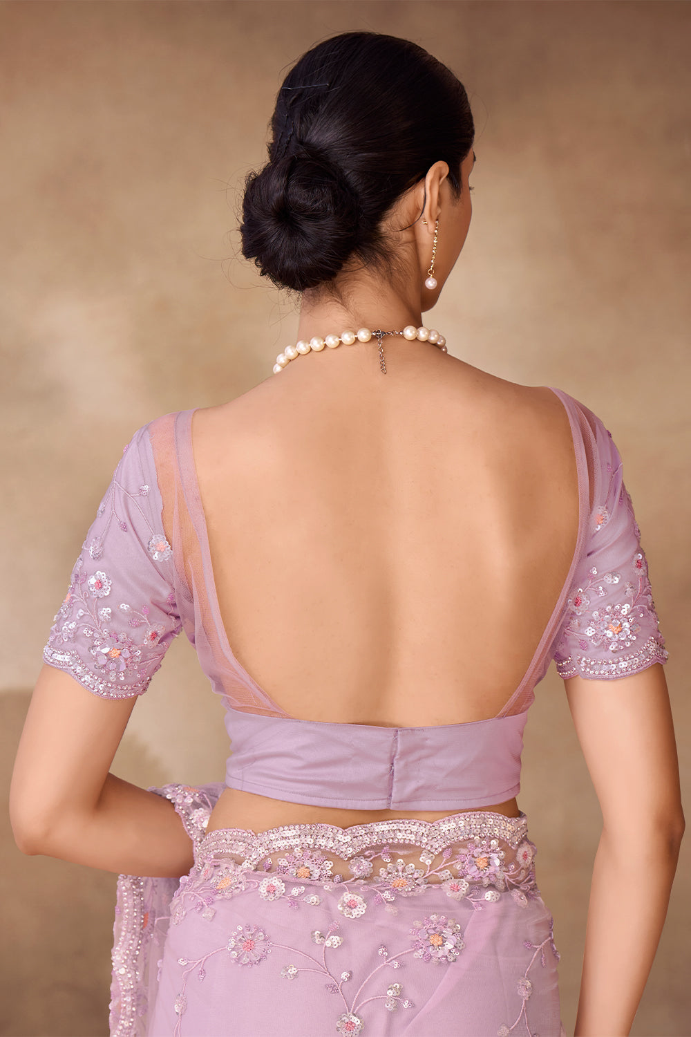 Beautiful Exclusive pastel shaded net saree with detailed work of sequins, thread and zarkan