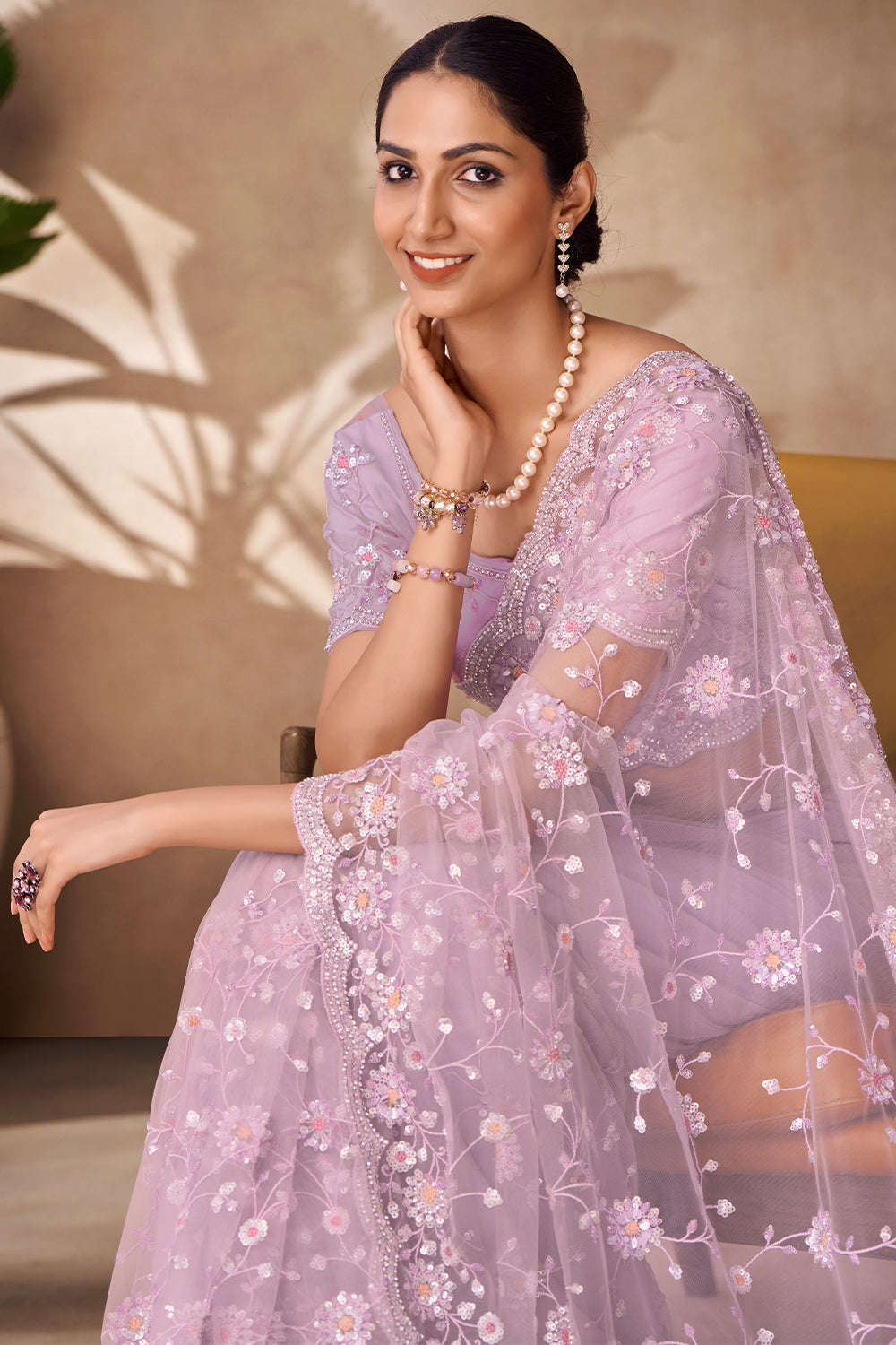 Beautiful Exclusive pastel shaded net saree with detailed work of sequins, thread and zarkan