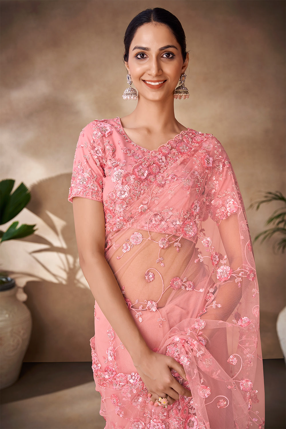 Beautiful Exclusive pastel shaded net saree with detailed work of sequins, thread and zarkan