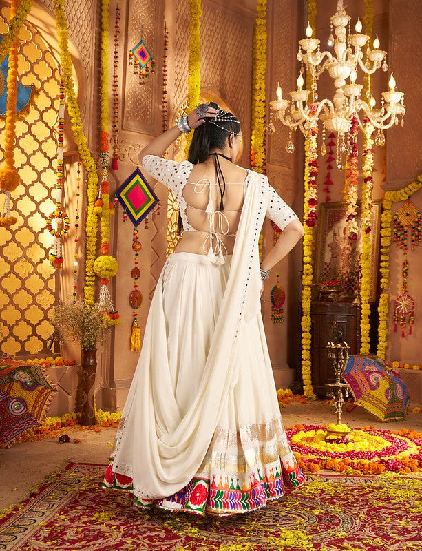Beautiful white Lehenga with mirror work blouse