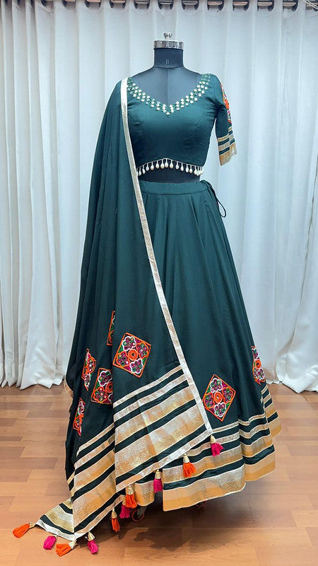 Dark green Lehenga with elegance of tassels and khatli work