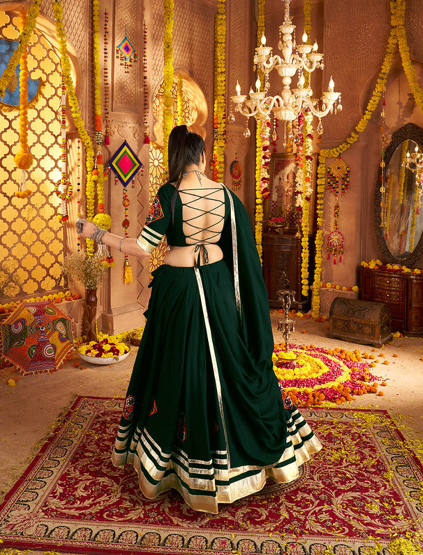 Dark green Lehenga with elegance of tassels and khatli work