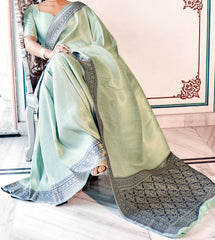 Pure Kanjivaram pastel green light shaded weaving silk handloom saree with contrasting dark border