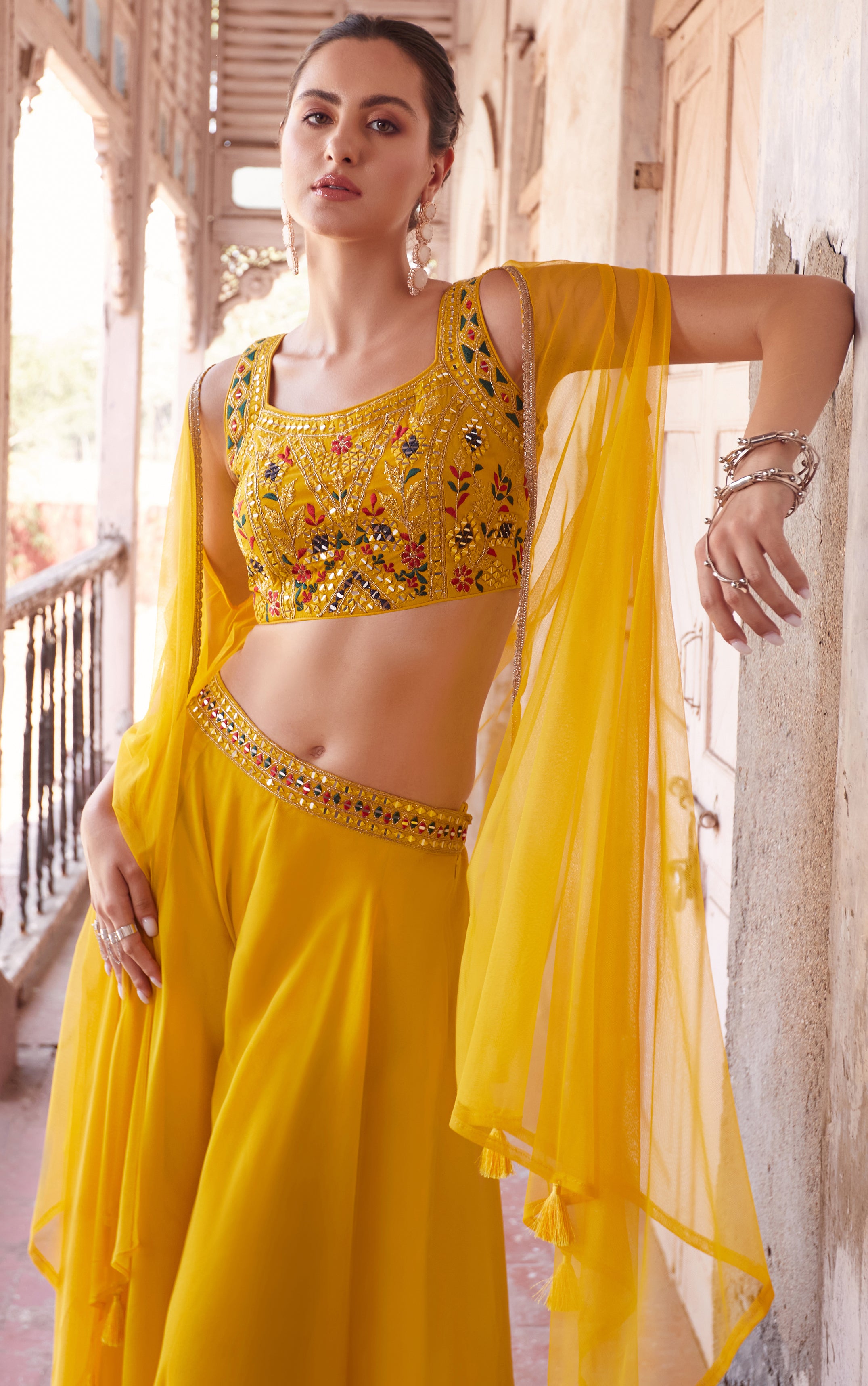 Yellow Designer sharara style inspired dress on pure georgette with detailed mirror, thread, hand embellished work