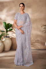 Beautiful Exclusive pastel shaded net saree with detailed work of sequins, thread and zarkan