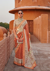 Weaved  light orange shaded Ajrak Inspired silk saree with gold finish | Silk saree